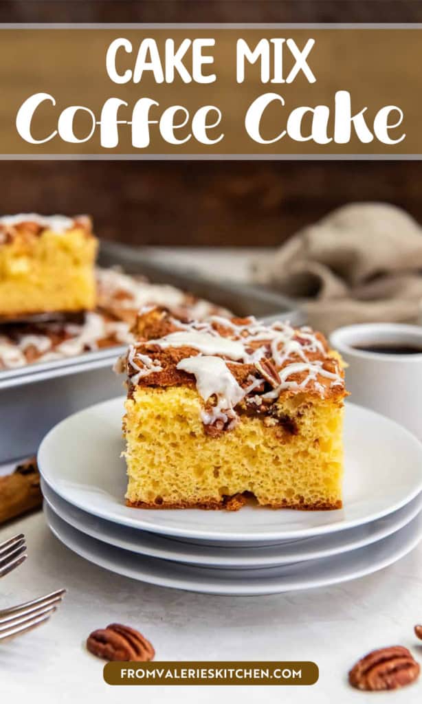 Slice of cake mix coffee cake on a white plate, topped with chopped pecans and a drizzle of icing, with coffee cups and the remaining cake in the background with text overlay.