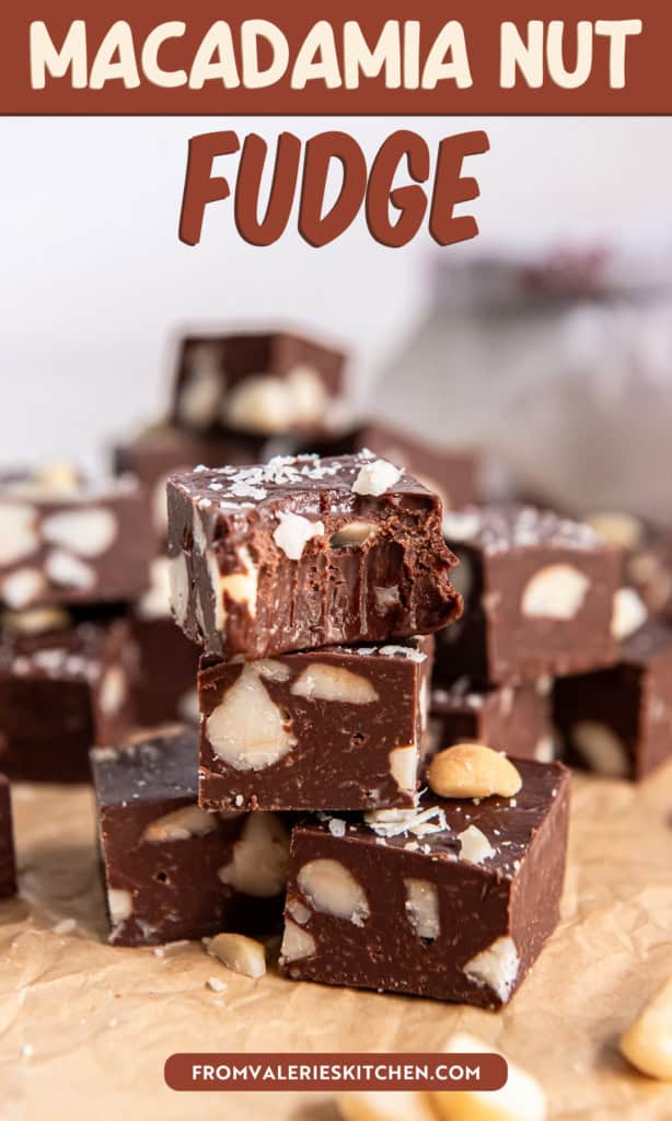 Close-up of stacked macadamia nut fudge with a bite taken out of the top piece with text overlay.