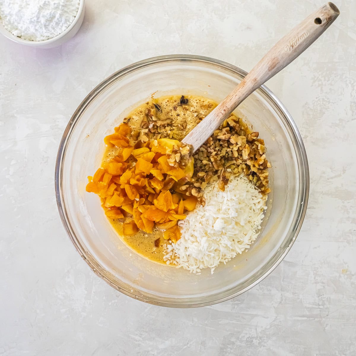 Chopped dried apricots, walnuts, and flaked coconut added to the apricot bar batter.