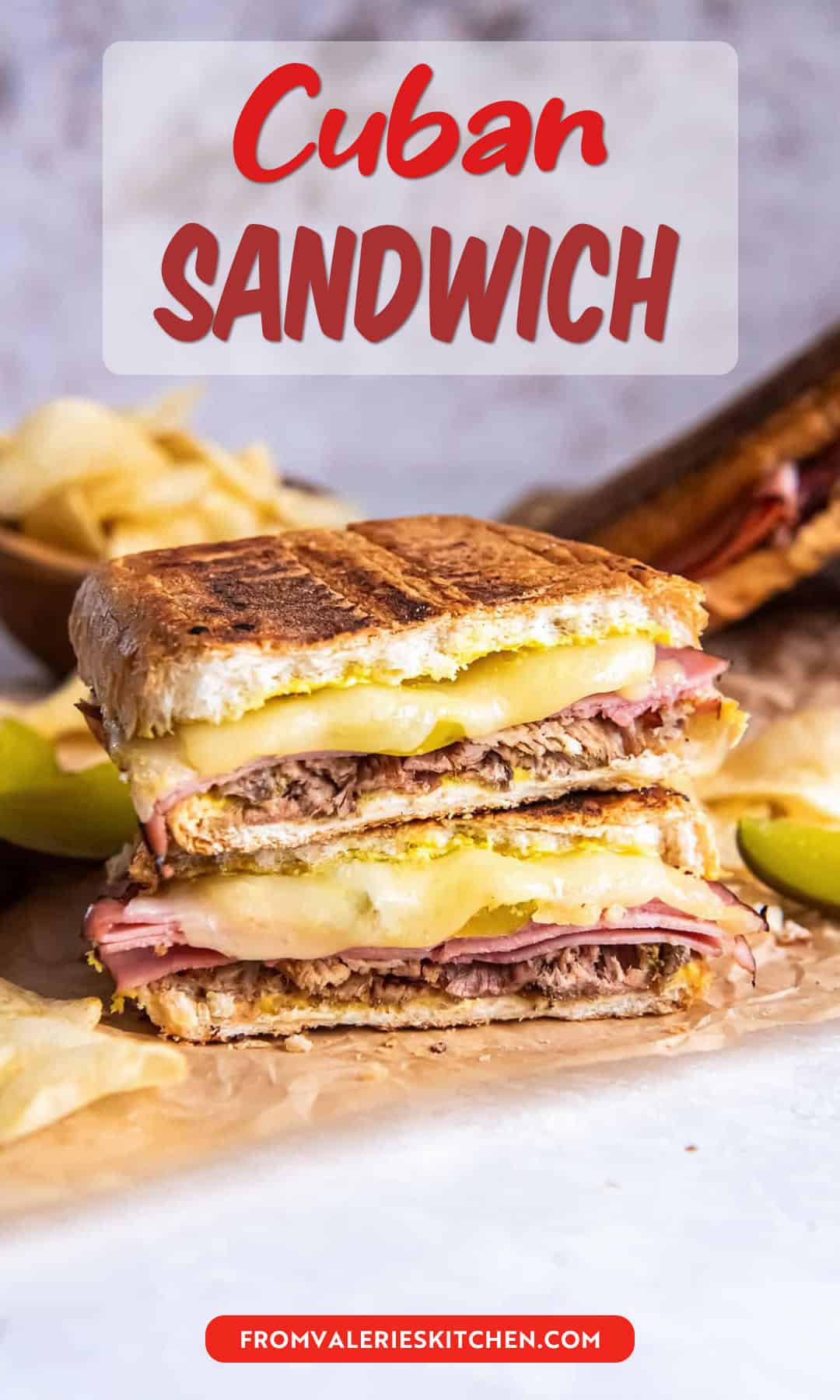 A pressed Cuban sandwich showing layers of roast pork, ham, melted Swiss cheese, pickles, and mustard on golden toasted bread with text overlay.