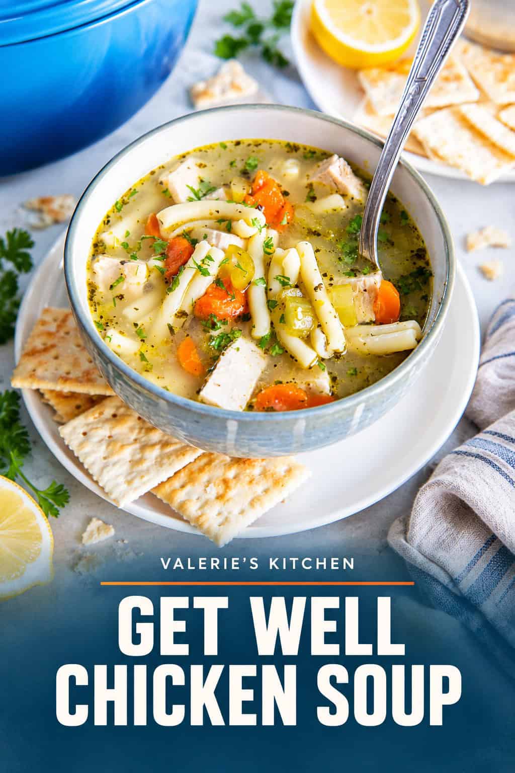 Chicken noodle soup in a white bowl with a spoon with bold title text overlay.