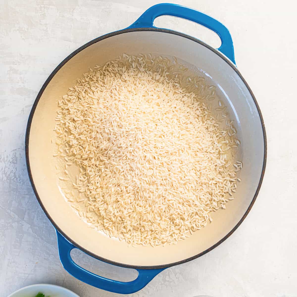 Rice in a blue skillet.