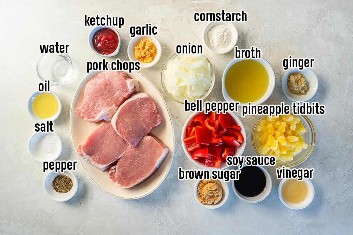 Hawaiian pork chop ingredients including boneless pork chops, pineapple tidbits, bell pepper and more in bowls with text overlay.