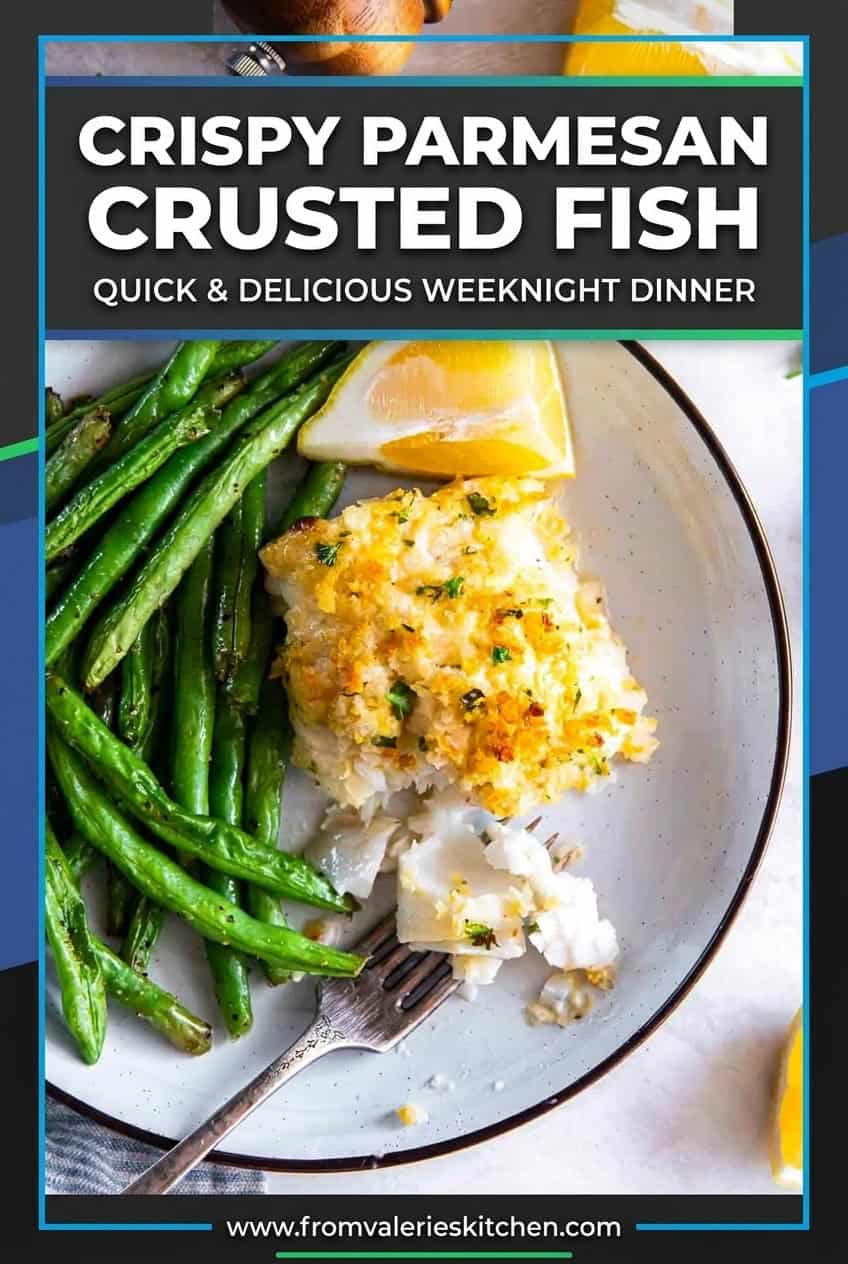 Flaky Parmesan crusted fish served with green beans and lemon wedges, with a fork breaking into the fish with text overlay.