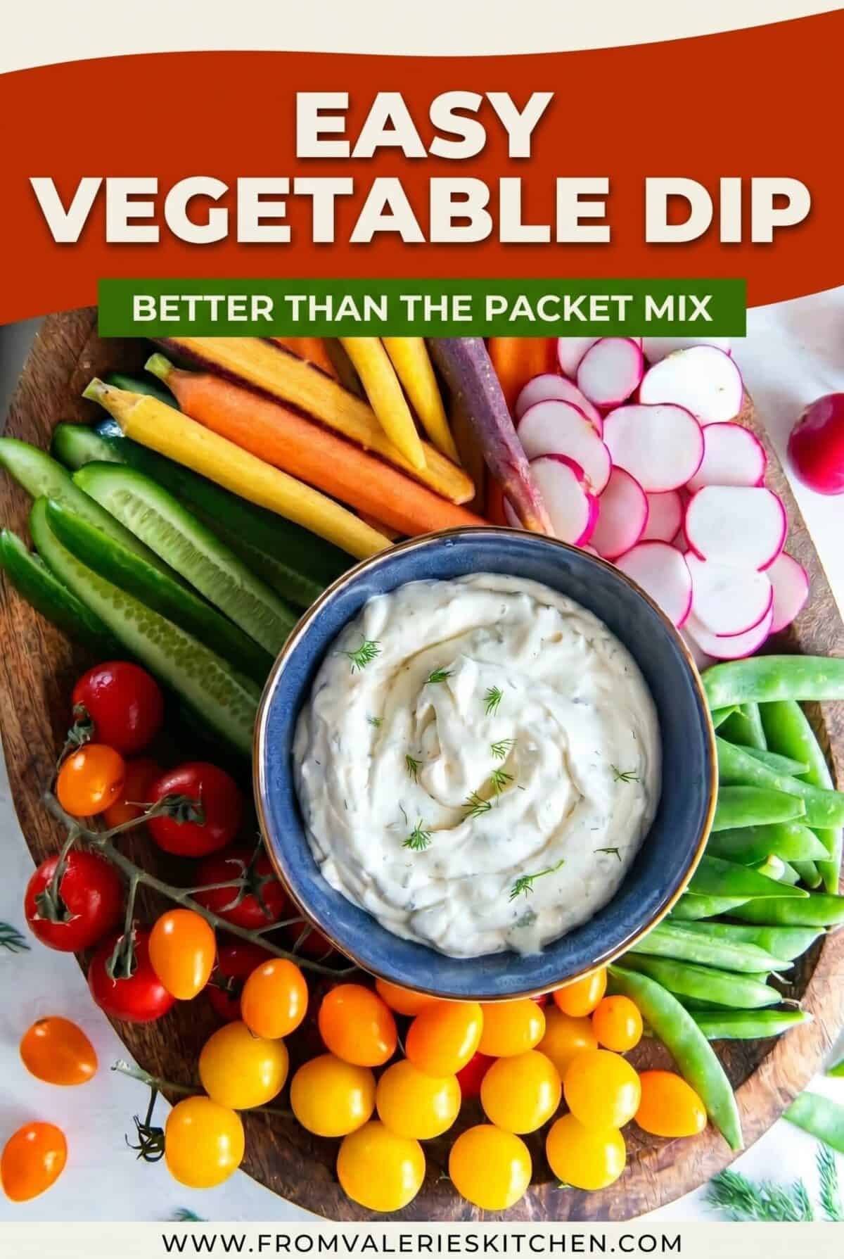 Single-image poster of a creamy homemade vegetable dip in a white bowl surrounded by a colorful platter of fresh vegetables, styled in orange, and green tones.