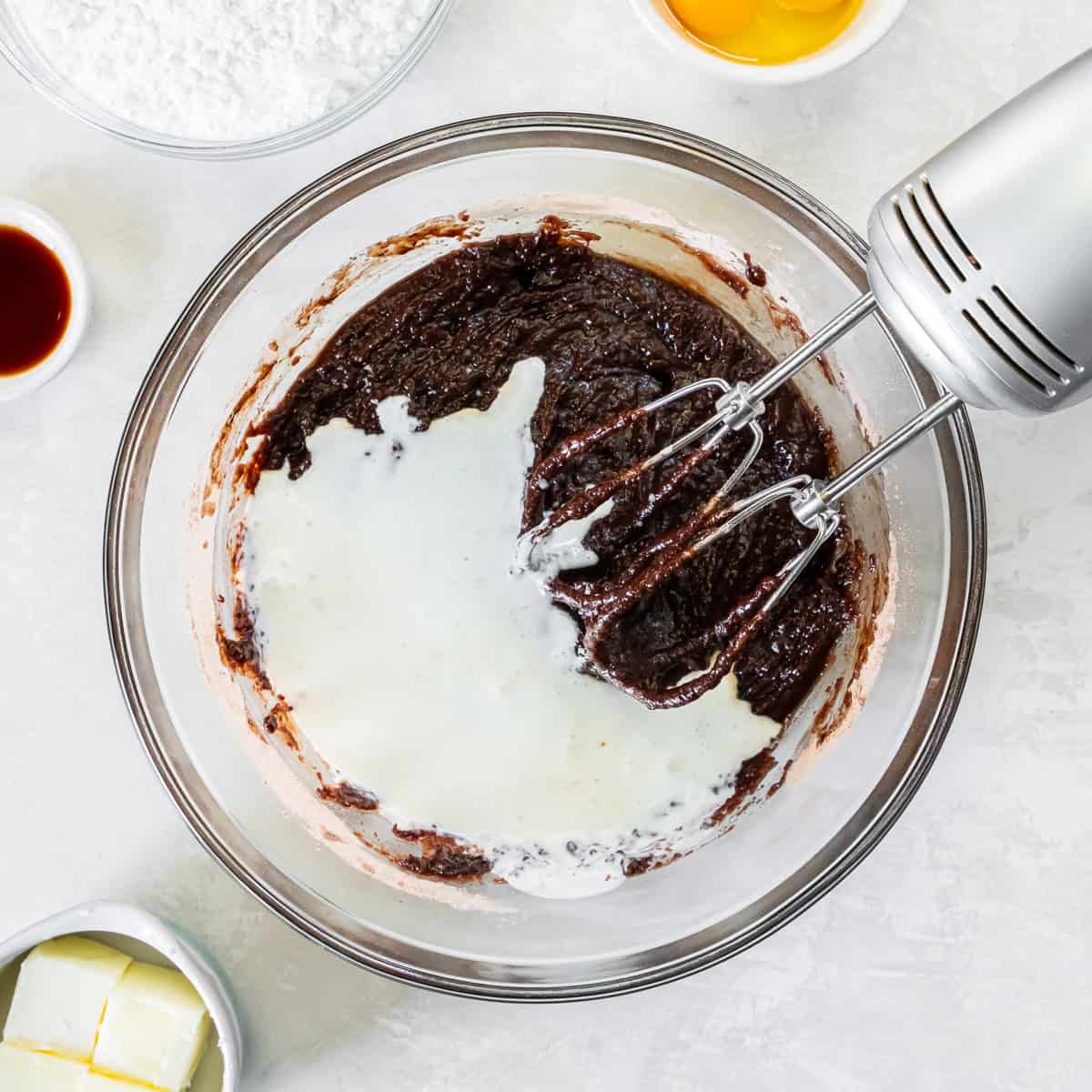 Buttermilk added to the chocolate cake mixture before mixing the batter for Coca-Cola Cake.