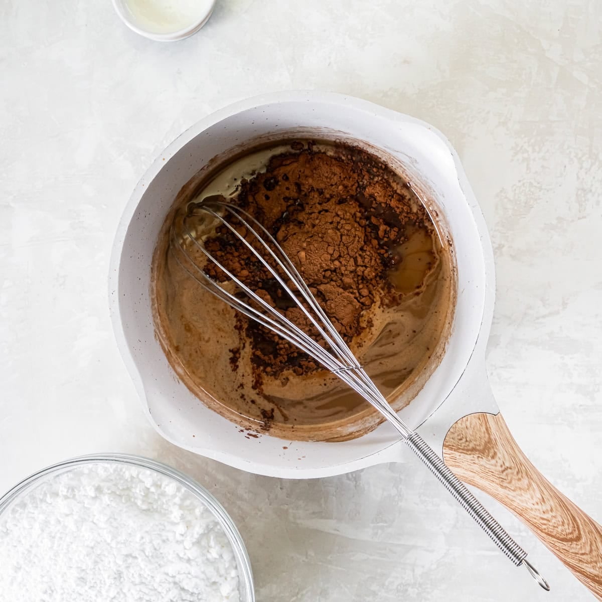 Cocoa powder added to the reduced Coca-Cola mixture for the glaze.