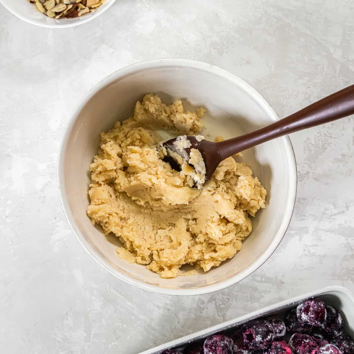 Soft cobbler dough mixed and ready to spoon over the cherry filling.