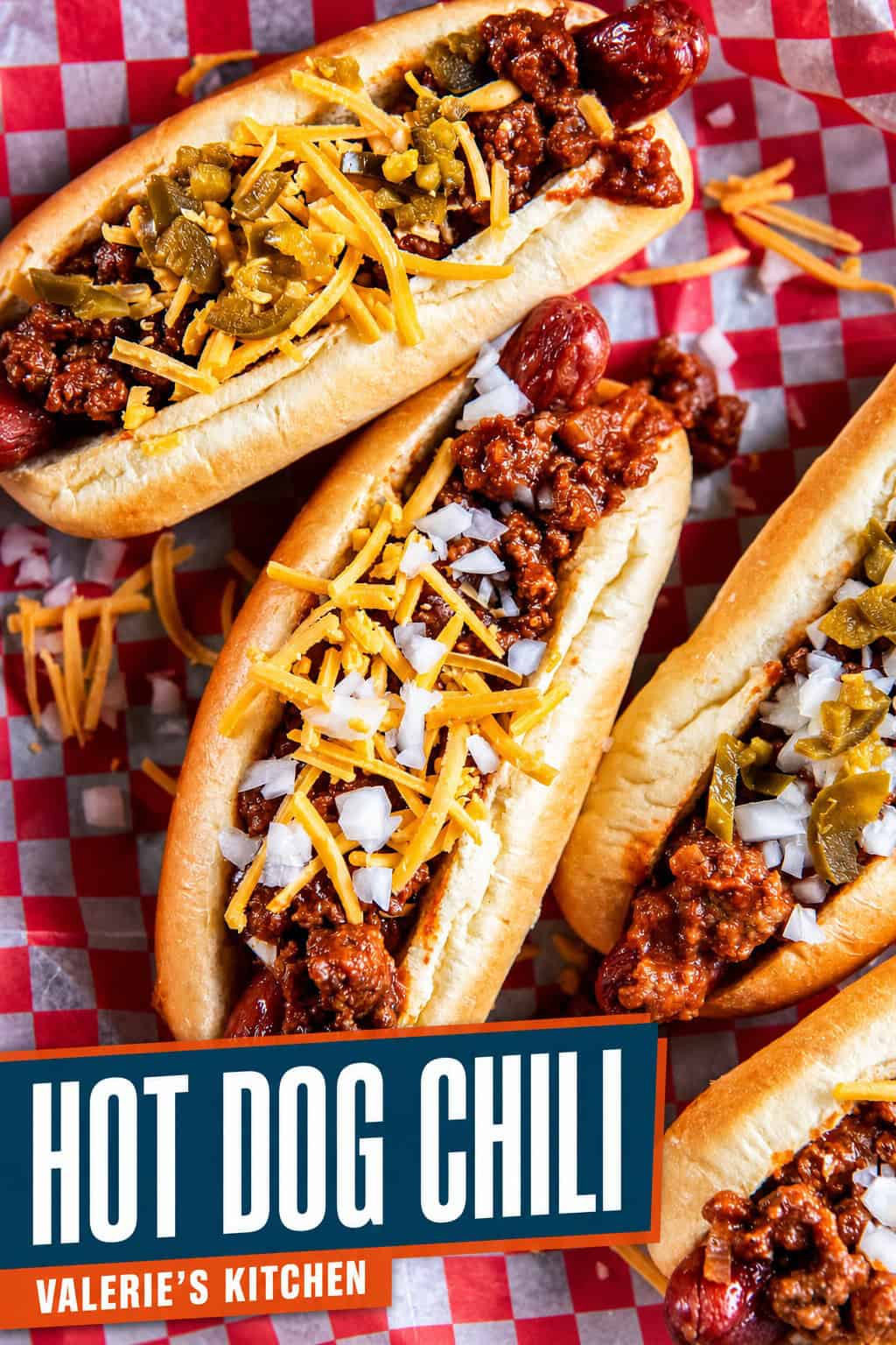 Bold editorial single-image poster in deep navy and burnt orange. All-caps condensed sans-serif headline reads HOT DOG CHILI over a close-up of chili-topped hot dogs loaded with cheese.