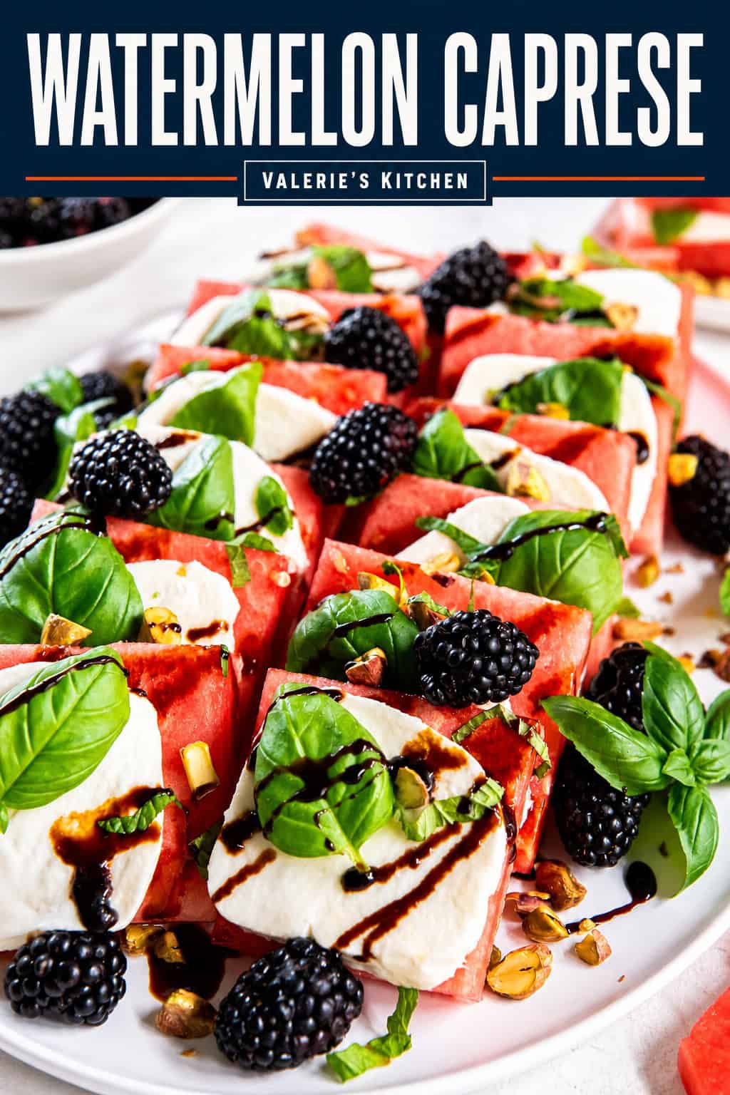 Watermelon Caprese arranged on a serving platter with fresh mozzarella, basil leaves, blackberries, chopped pistachios, and a drizzle of balsamic glaze with bold text overlay.