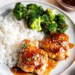 Baked Teriyaki Chicken thighs glazed with homemade teriyaki sauce and served with white rice and broccoli.
