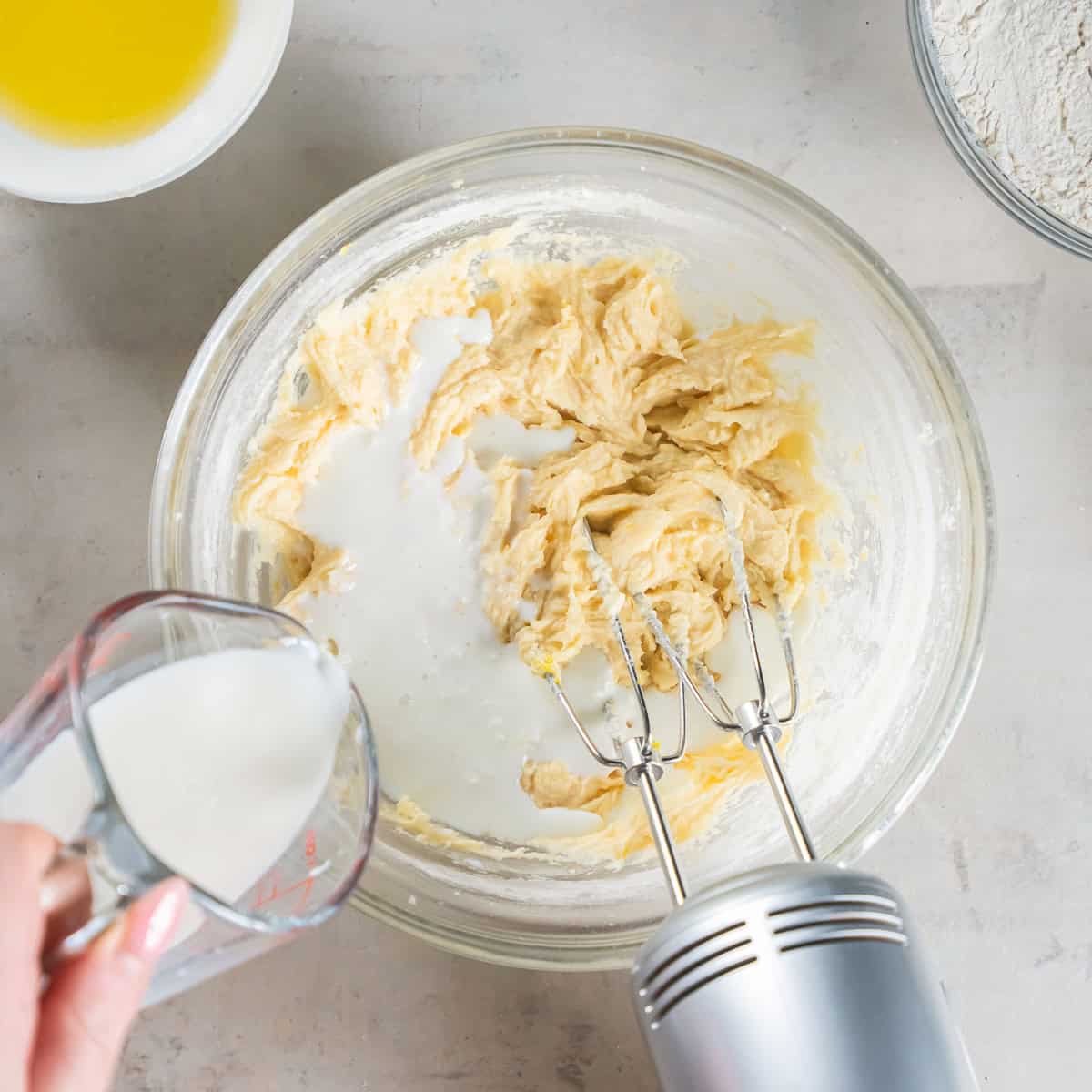 Alternating the buttermilk with the dry ingredients while mixing the Cherry Coffee Cake batter.