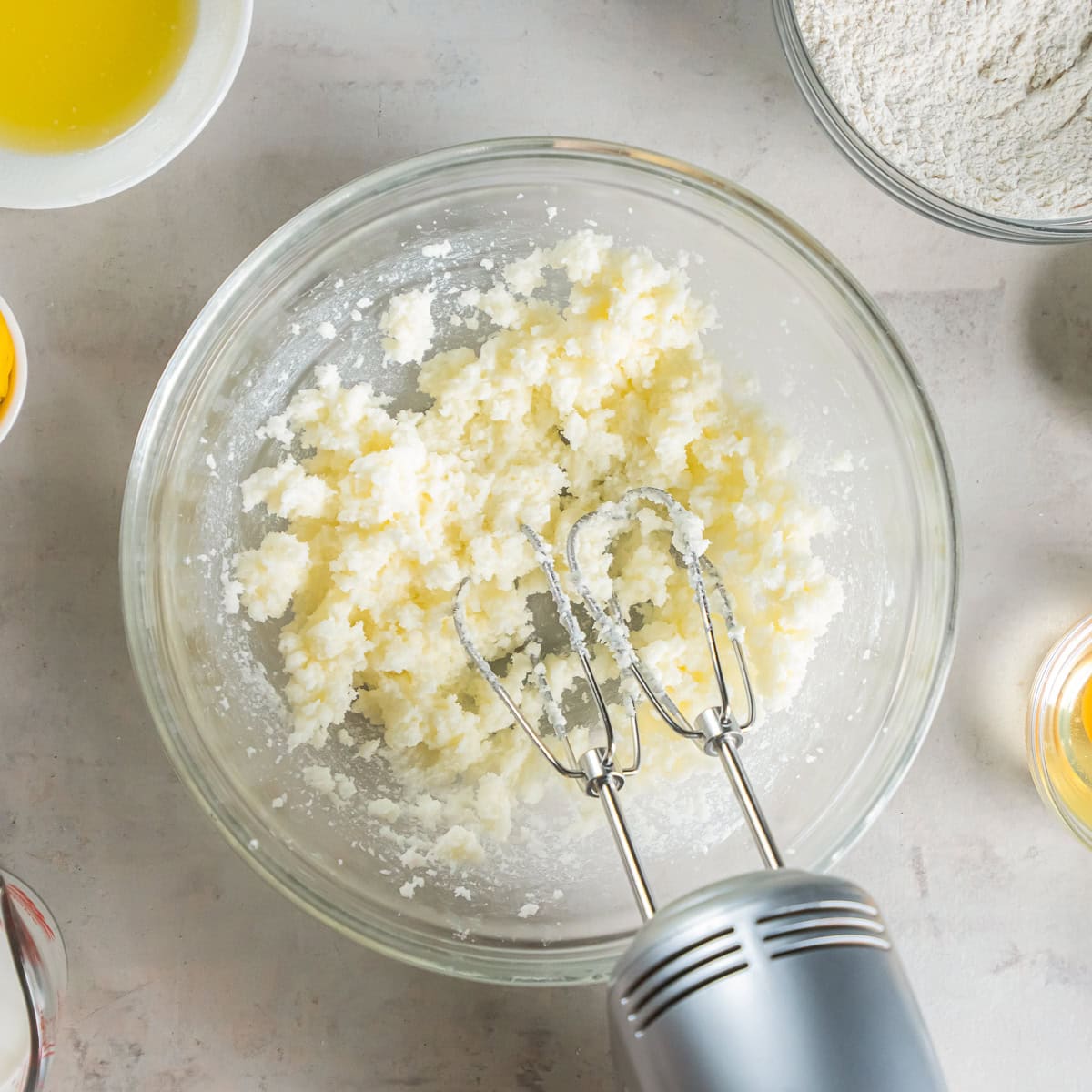 Creaming the butter and sugar together until light and fluffy.