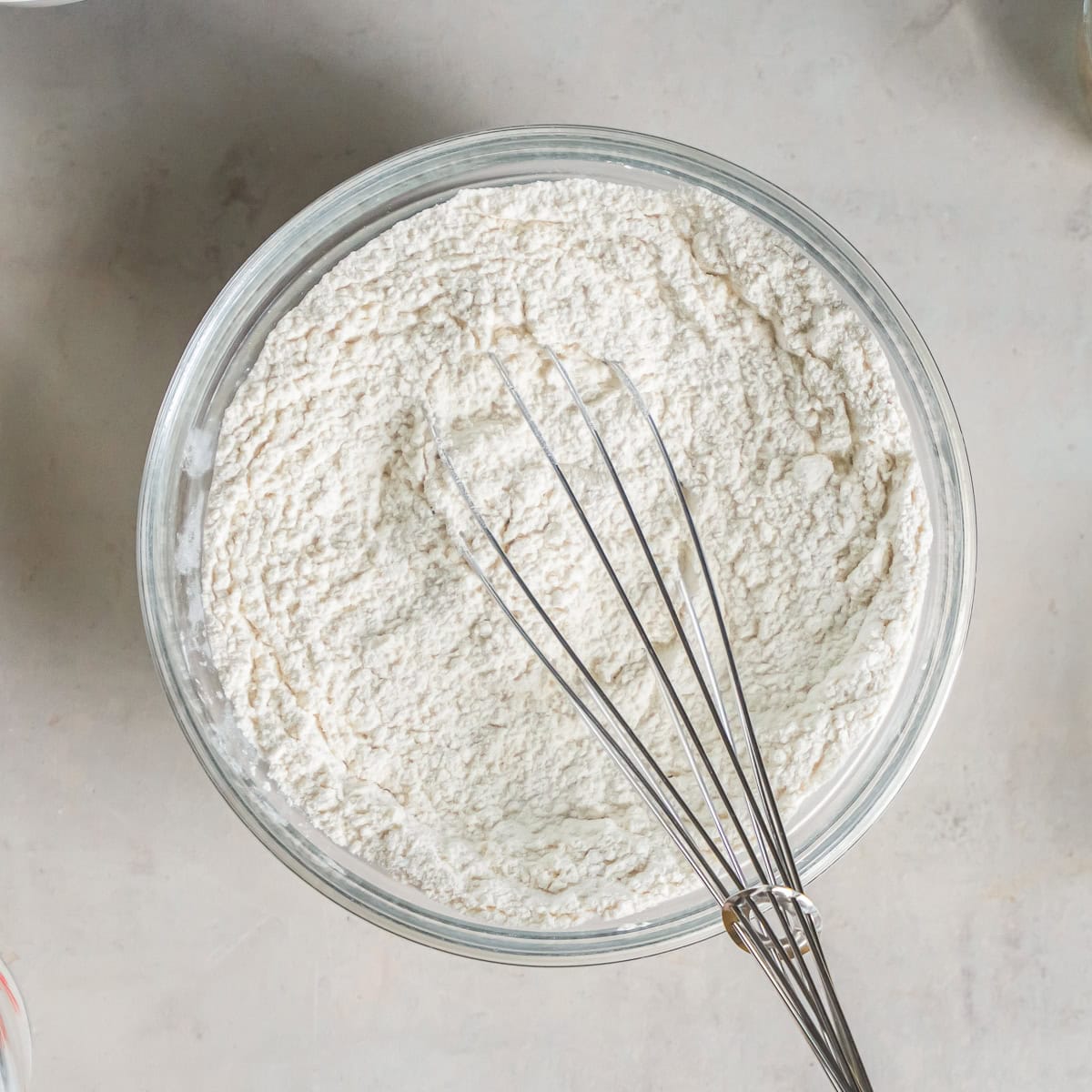 Whisking together the flour, baking powder, and salt for Cherry Coffee Cake.