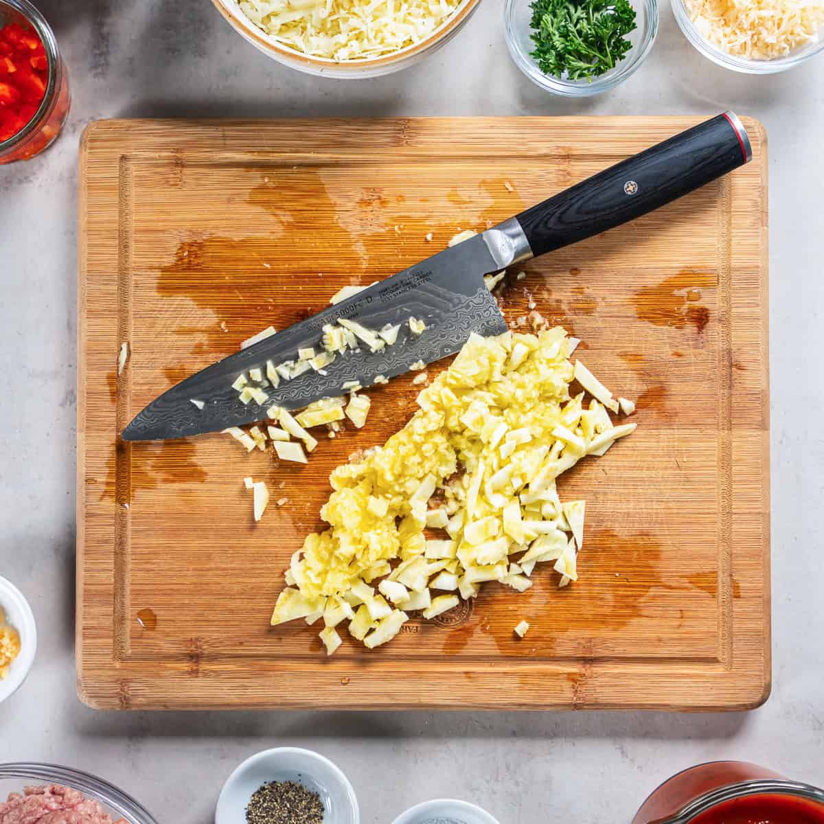 Chopped zucchini flesh for the Italian Stuffed Zucchini Boats filling.