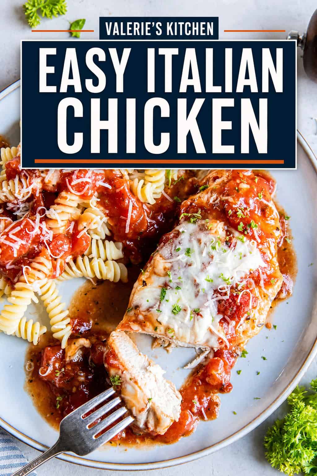 Italian baked chicken served with rotini pasta topped with chunky tomato sauce and grated Parmesan with bold text overlay.