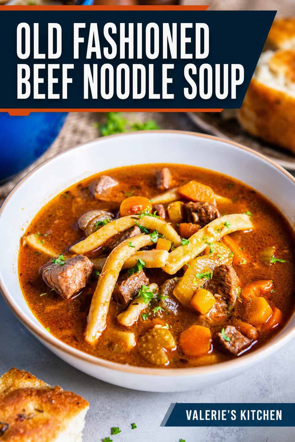 Old-fashioned beef noodle soup with tender beef, thick egg noodles, carrots, celery, and parsley in a rich beef broth with bold title text overlay.