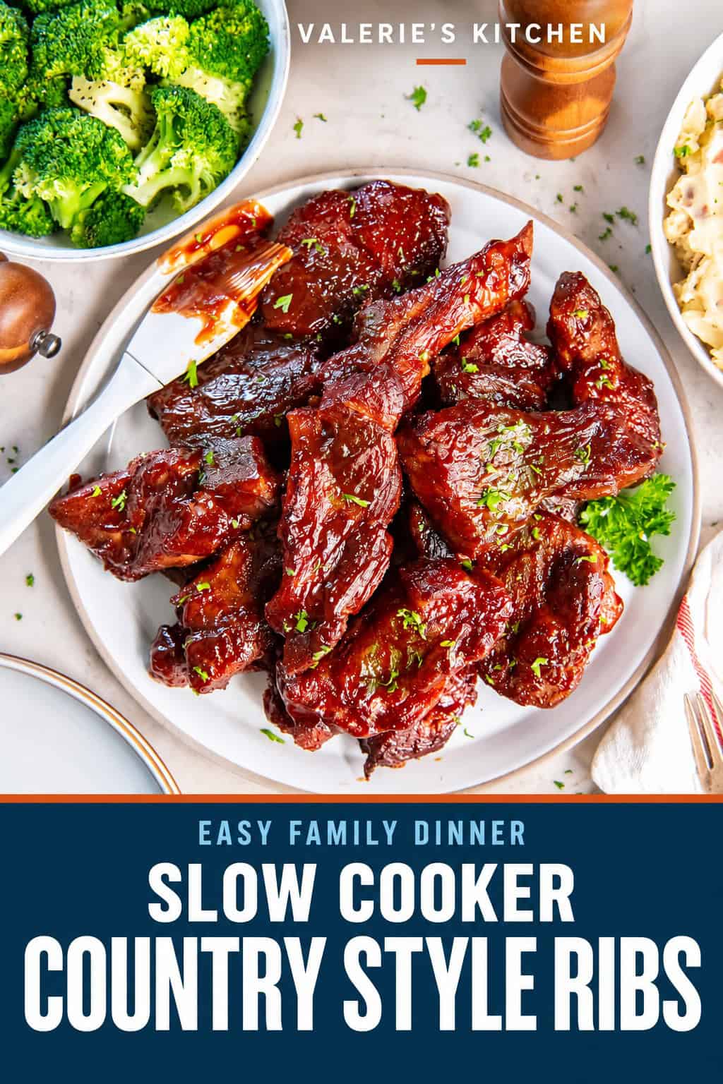 Slow Cooker Country Style Ribs coated in sticky, caramelized BBQ sauce with a sauce-covered pastry brush alongside with bold title text overlay.