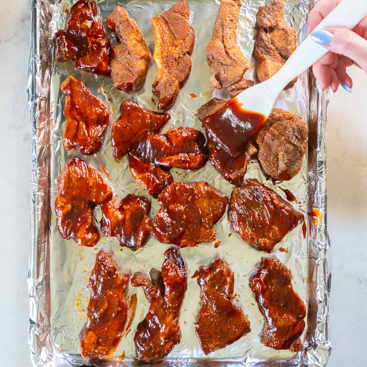 Brush generously with additional BBQ sauce.