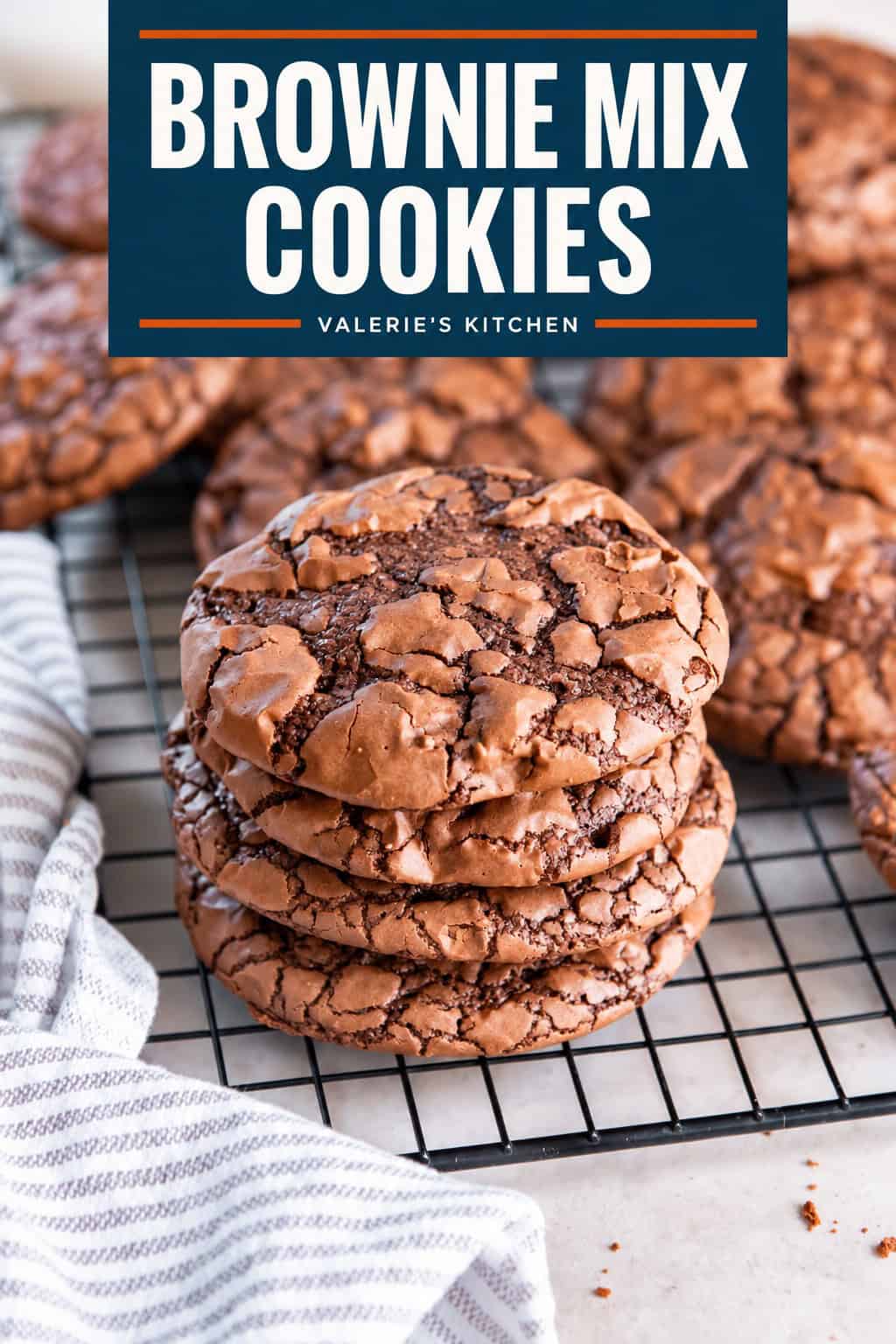 Stack of brownie mix cookies with shiny, crackly tops on a wire cooling rack with bold title text overlay.