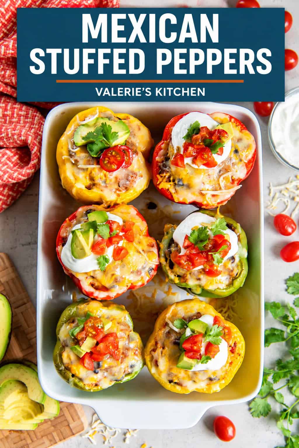 Mexican Stuffed Peppers topped with melted cheese, sour cream, avocado, diced tomatoes, and cilantro in a white baking dish with bold title text overlay.