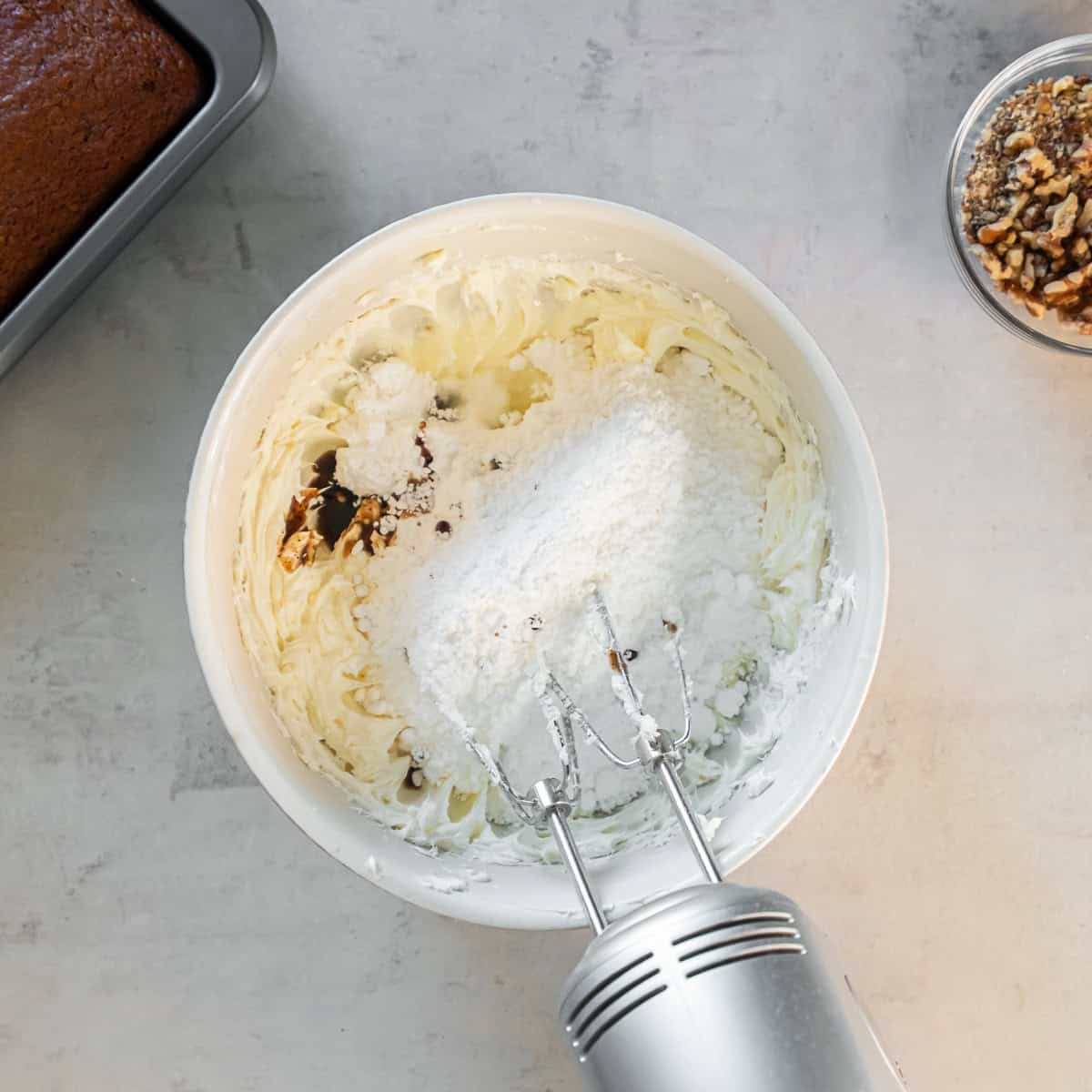 Powdered sugar and vanilla added to the beaten cream cheese and butter.