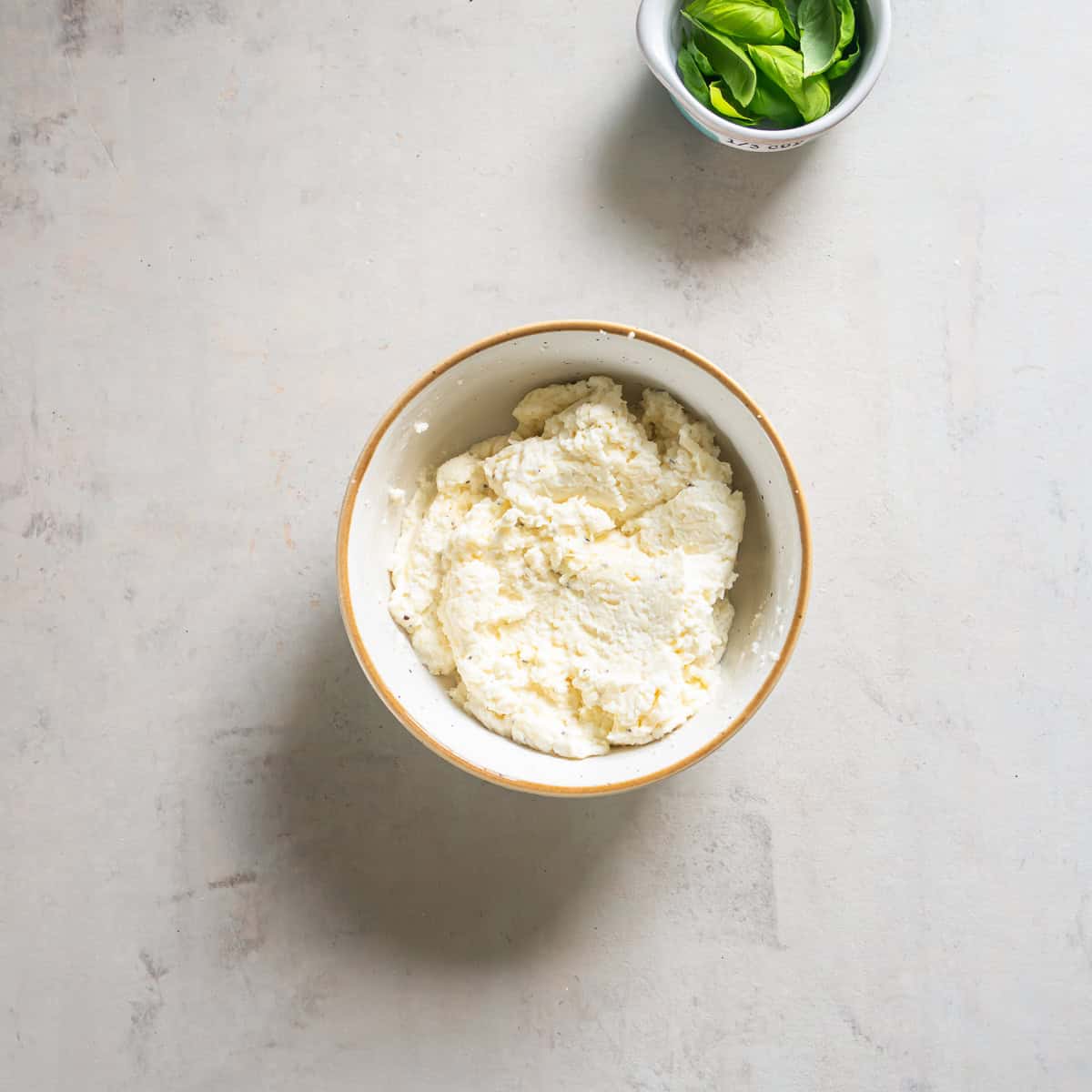 A ricotta cheese mixture in a small bowl.